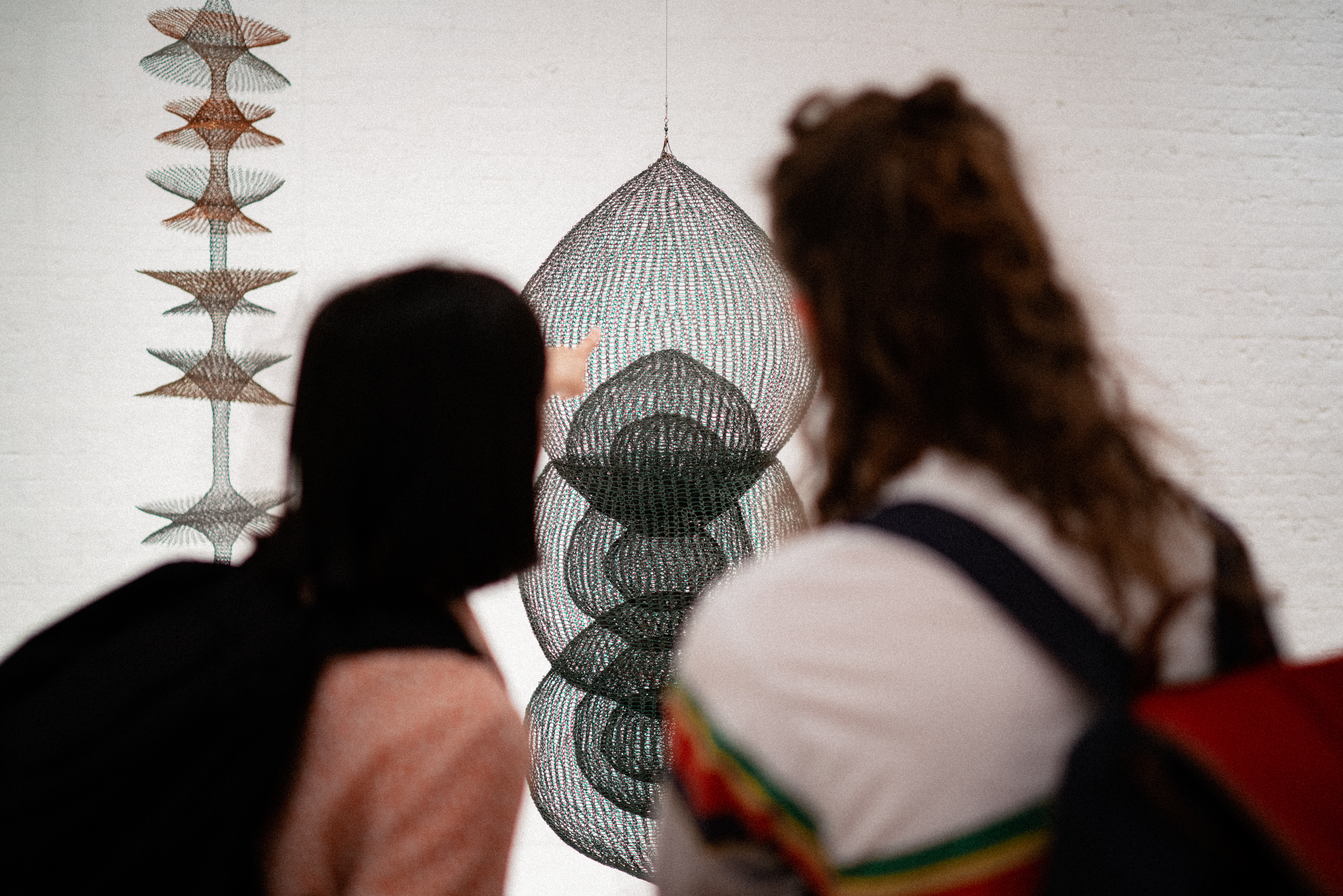 Two people looking at an art exhibit in Modern Art Oxford