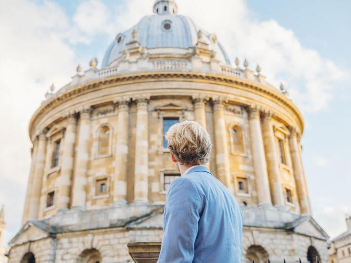 Man looking up at an historical building