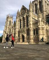Man and woman dancing outside an historic building