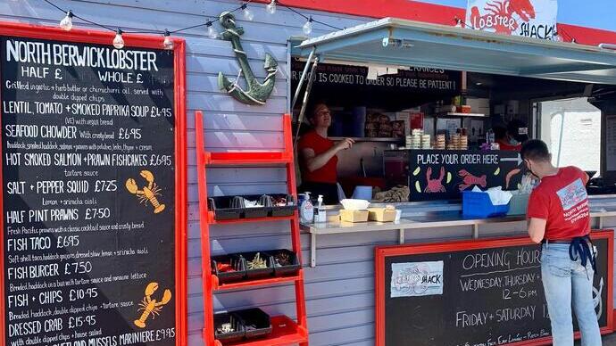 person being served at the Lobster shack cafe
