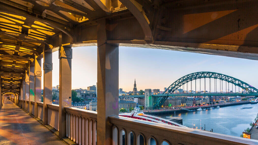 View from pedestrian level of the two bridges connecting Newcastle and Gateshead during a summer evening in June.