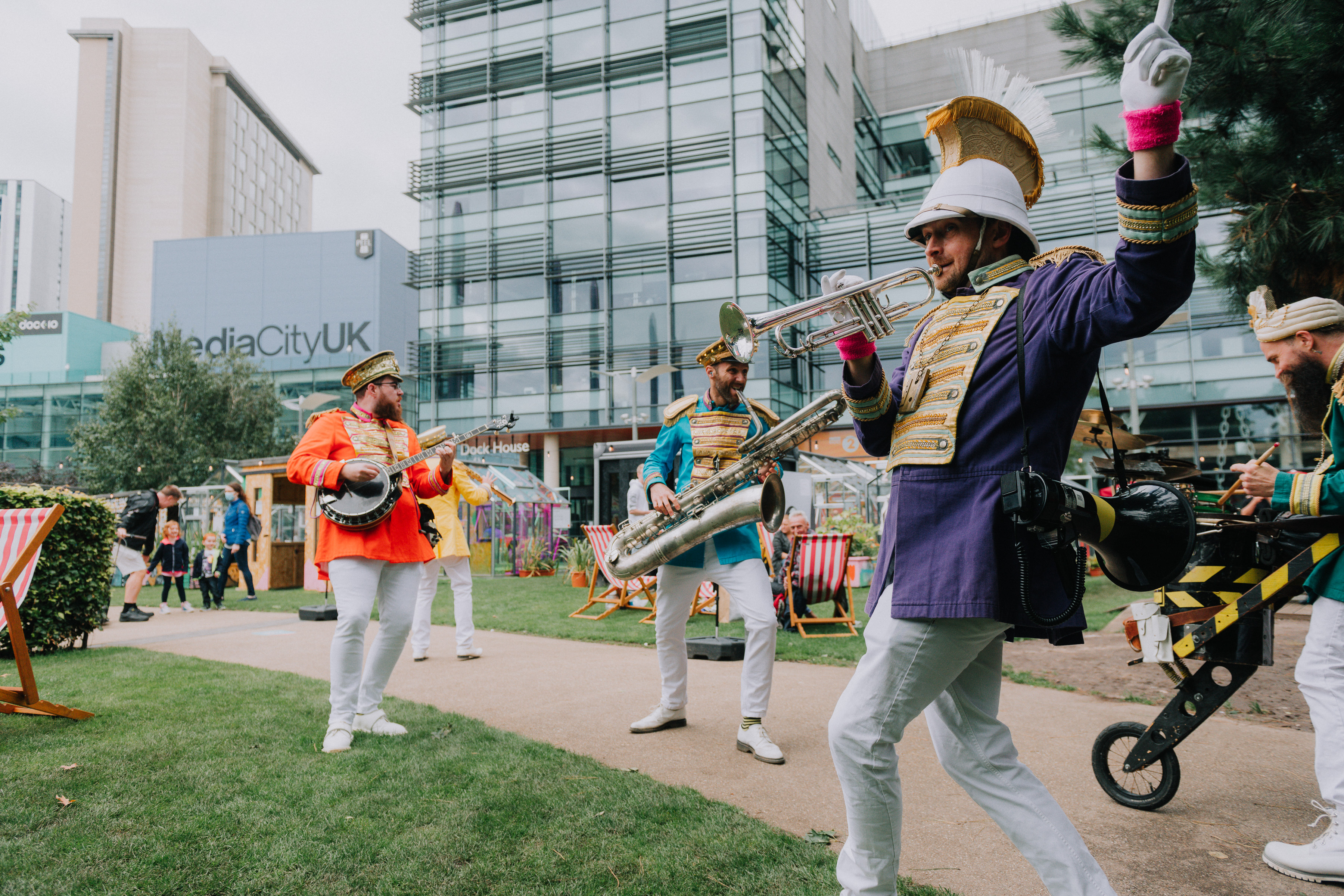 A band playing in the outside square of Manchester's Media City
