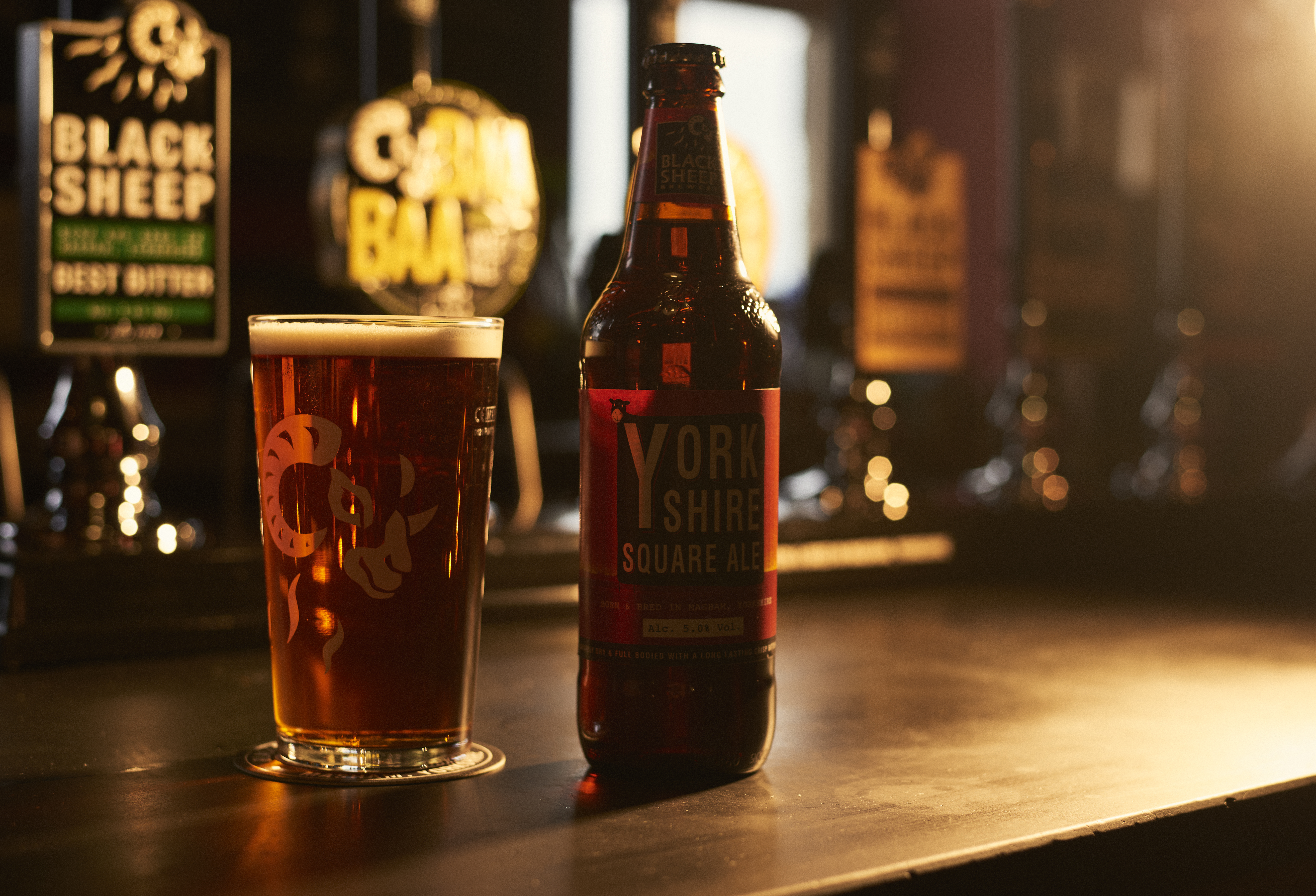 Close up of selection of beers on wooden shelf