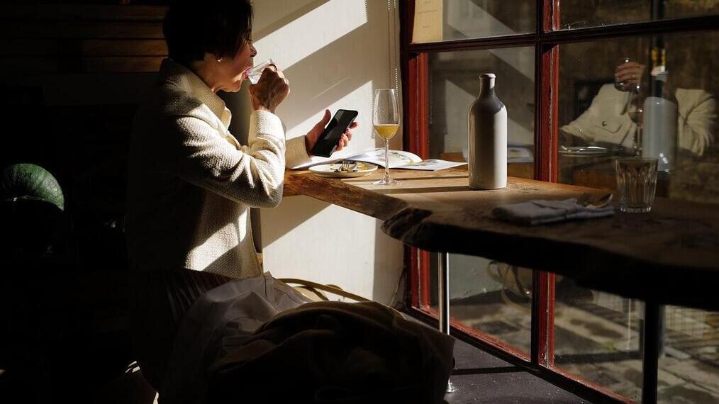 Person sitting at a counter in Oak, a restaurant in Bath