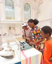 A family looking at an exhibit in York Art Gallery