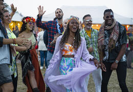 A group of friends having fun at a festival.
