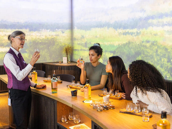Three women having a tasting session at a whisky distillery