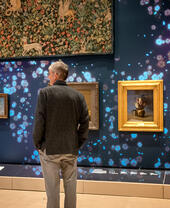 A person looking at artworks in a gallery in Glasgow