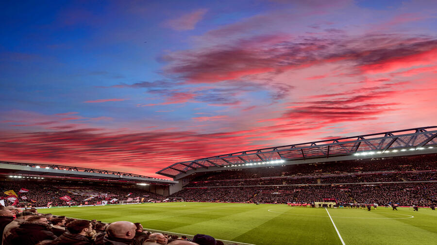 Red clouds in sunset over the ground of a stadium