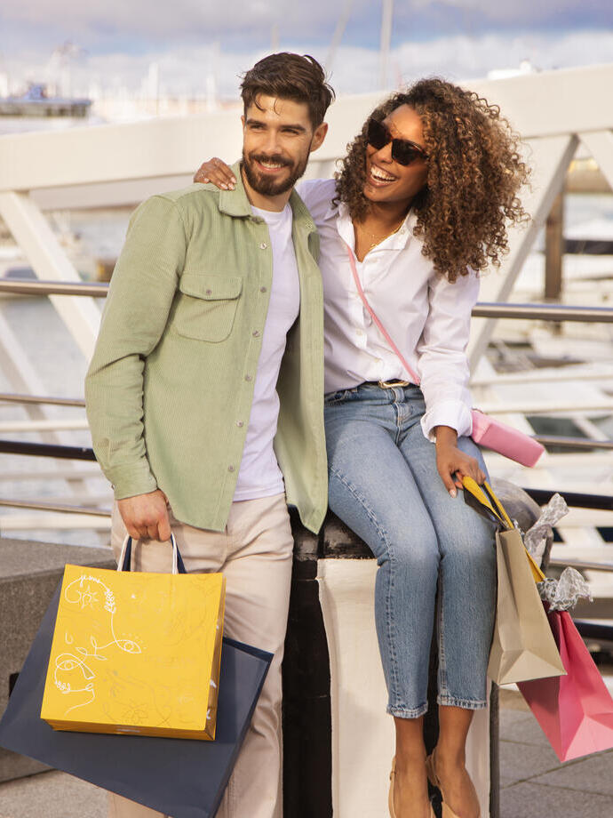 Two people with shopping bags