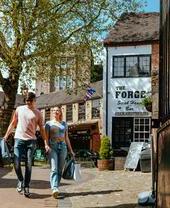 A couple walking through a courtyard