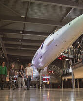 A family explore an Aerospace museum