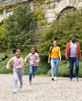 A family exploring the grounds of the Bowes Museum