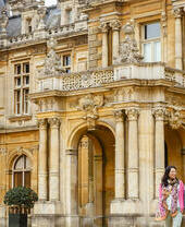 Couple walking outside a stately home