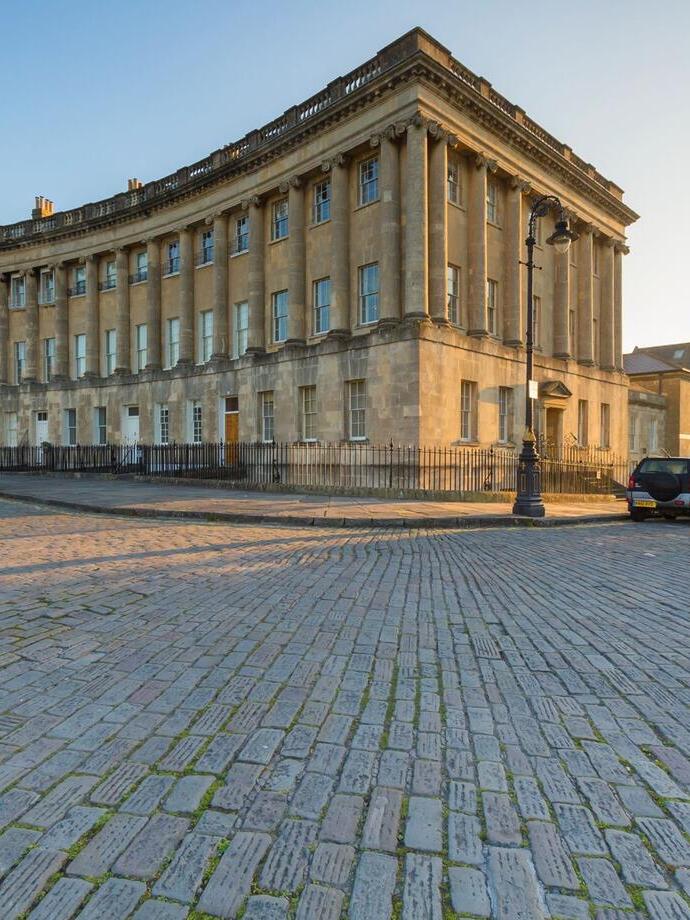 A view of a famous crescent building in the sunlight.