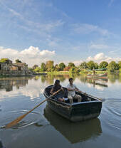 Man and woman in a rowing boat on a lake