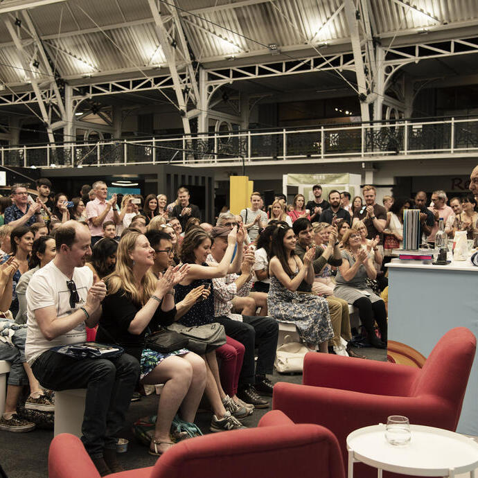 People clapping during the Traveller Food Festival show