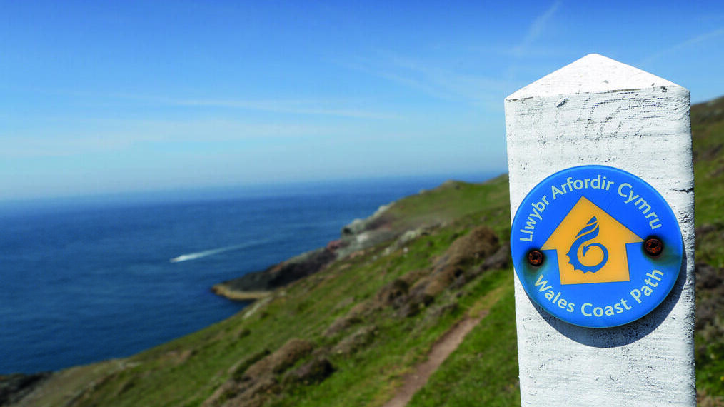 Marker alongside a coastal walking trail