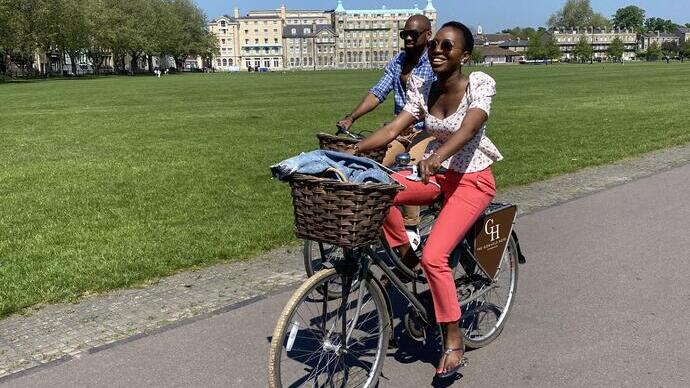Woman and a man riding bicycles in a park