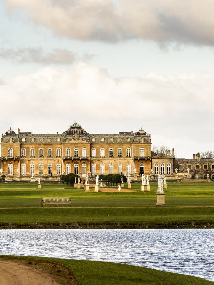 A formal Country Estate, and its lake and formal gardens and manicured lawns