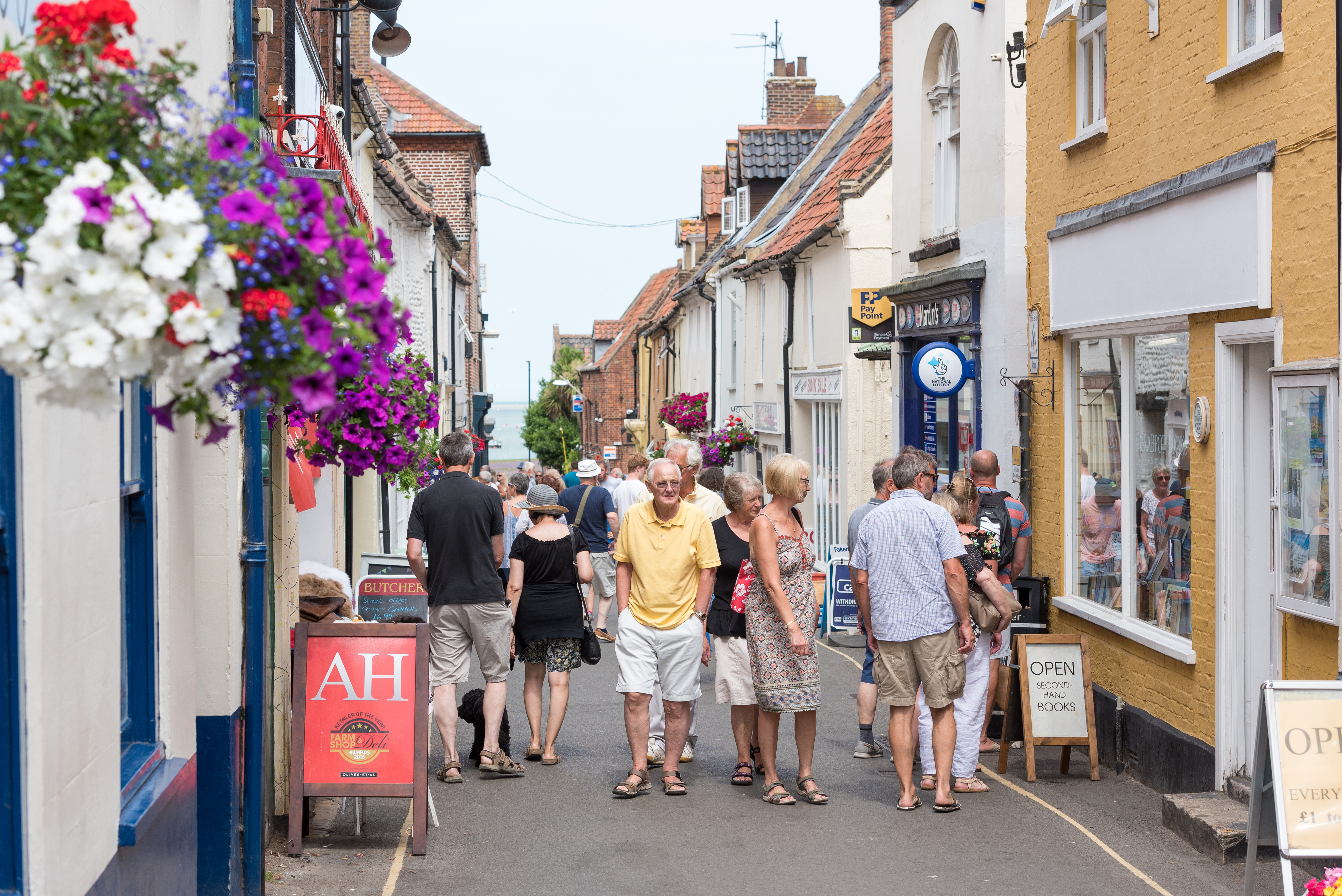 People walking through a shopping street in Wells-next-the-Sea