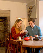 A man and a woman drinking tea at Bertram’s