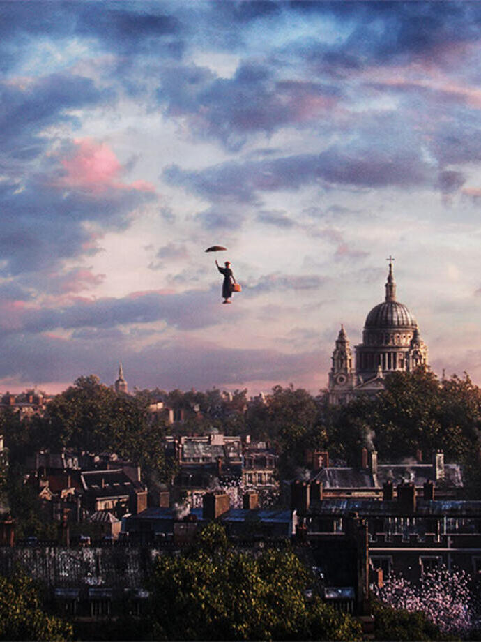 Person with umbrella floats above a city skyline at sunset, St Paul's Cathedral visible among rooftops and trees.