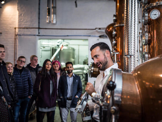 A tour group being shown around a gin distillery in Leeds
