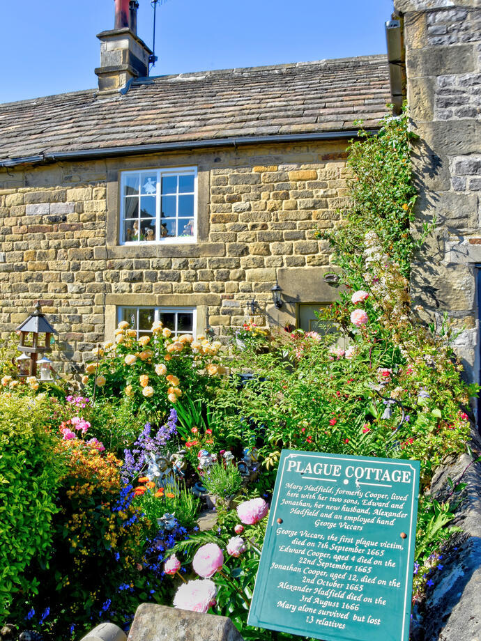 A stone cottage in the countryside.