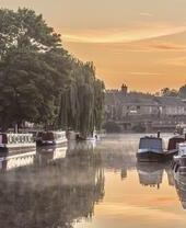 Canal boats moored along the River Great Ouse in Ely
