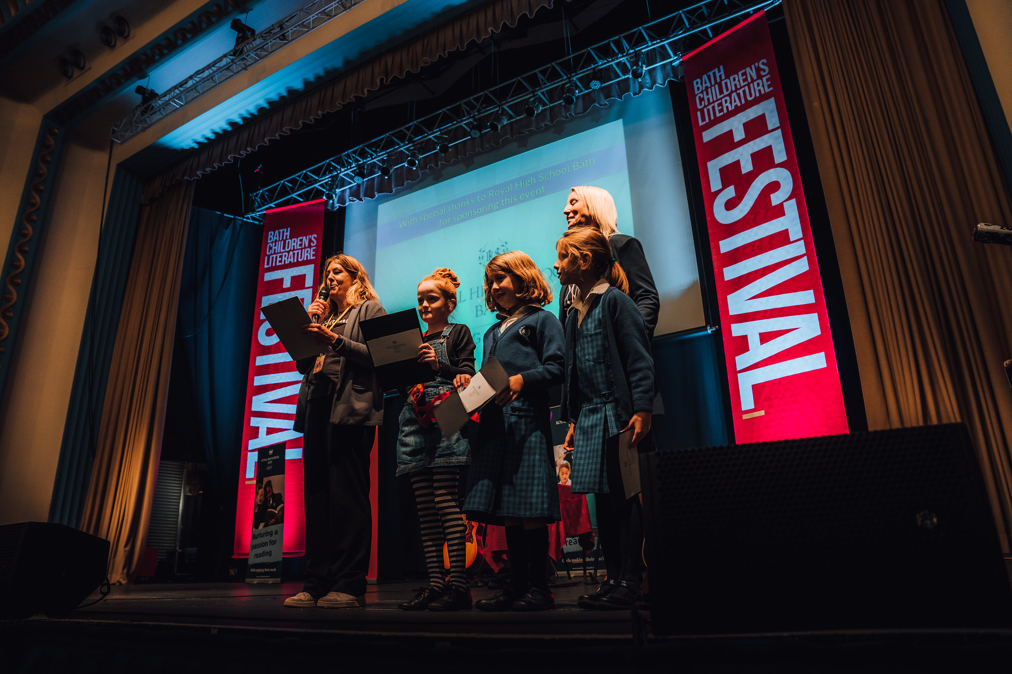People speaking on stage at Bath Children's Literature Festival