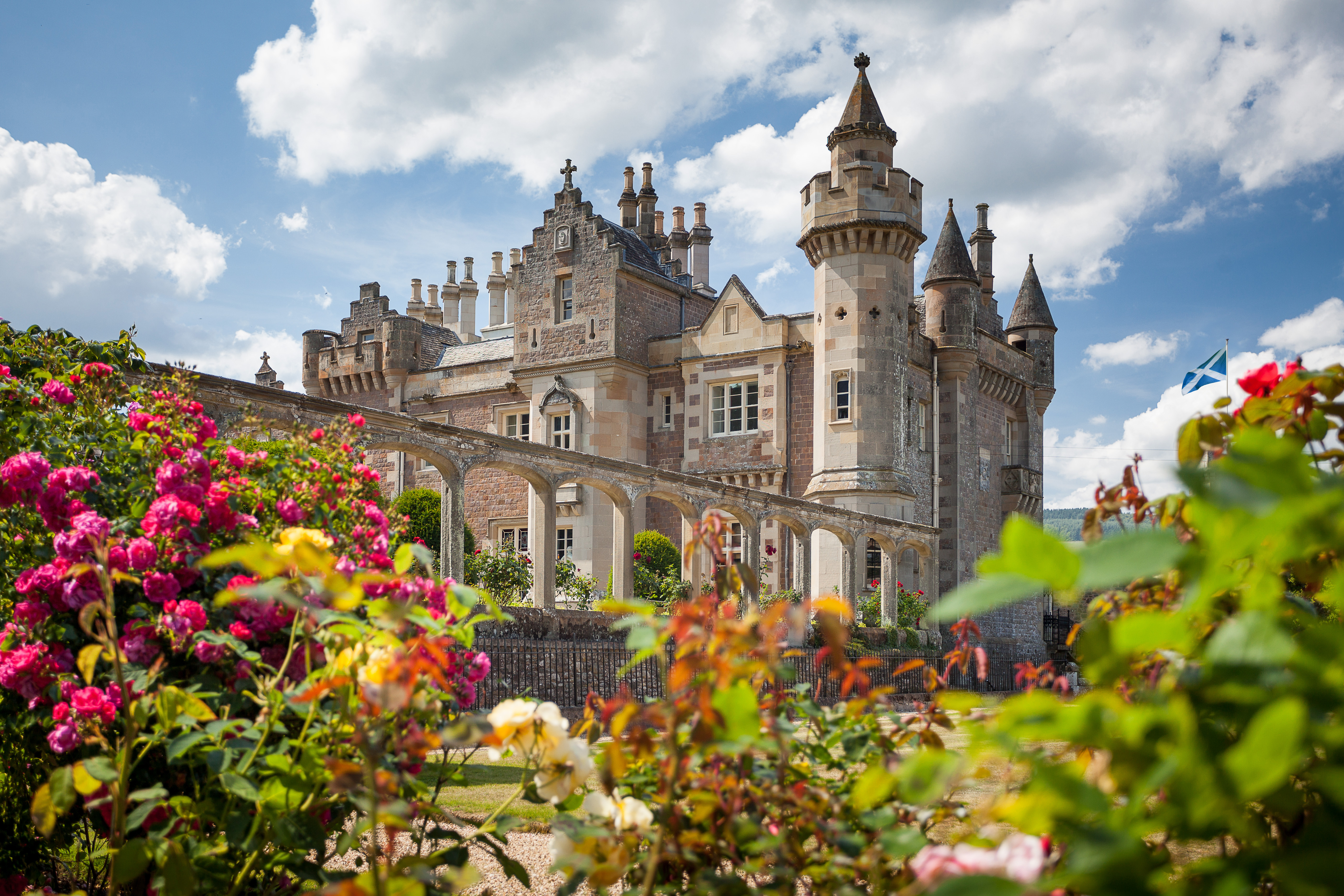 Abbotsford exterior with flower gardens in foreground
