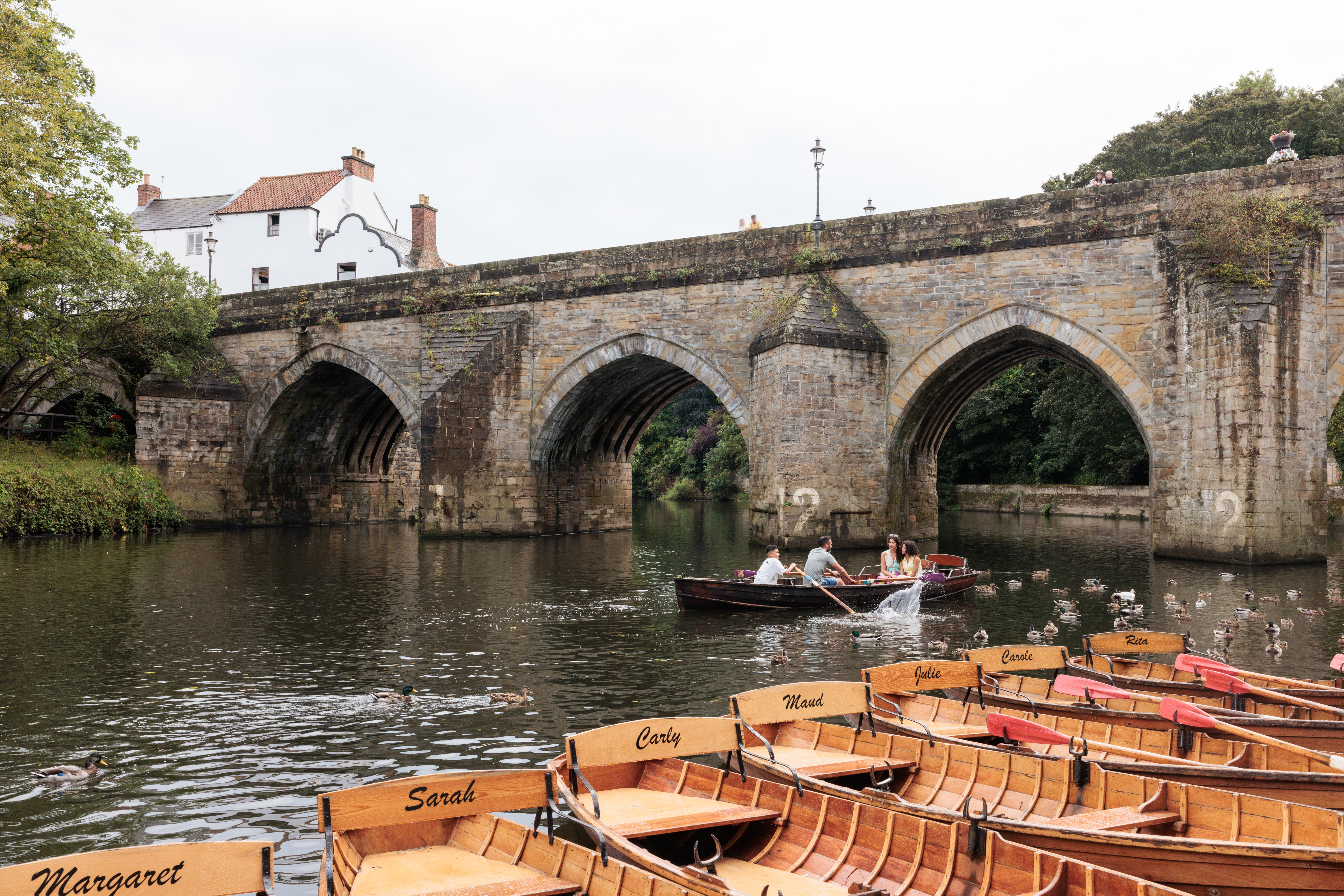 A family rows along the River Wear in a rented boat