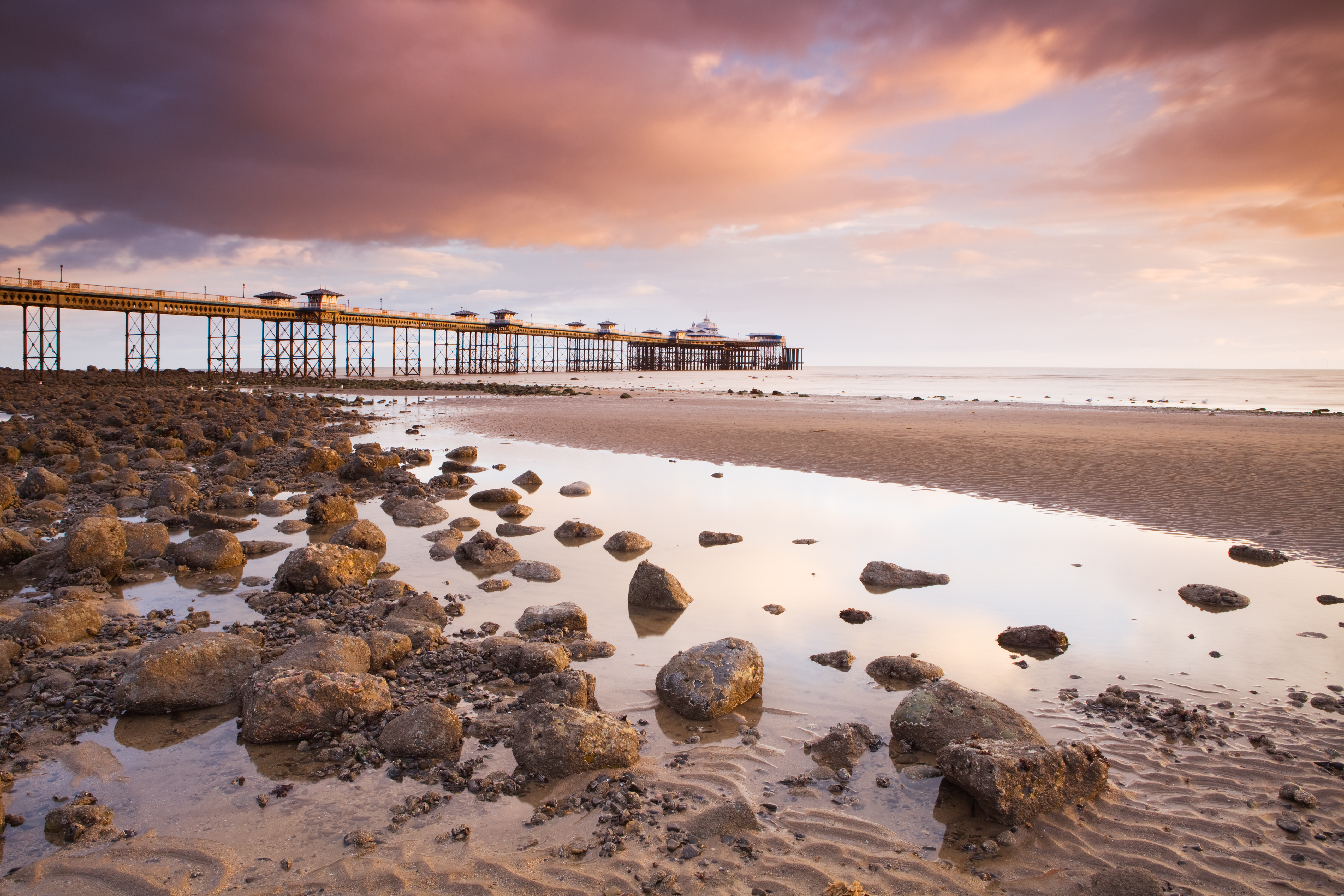 Pier built out into the sea in grand Edwardian style at dusk