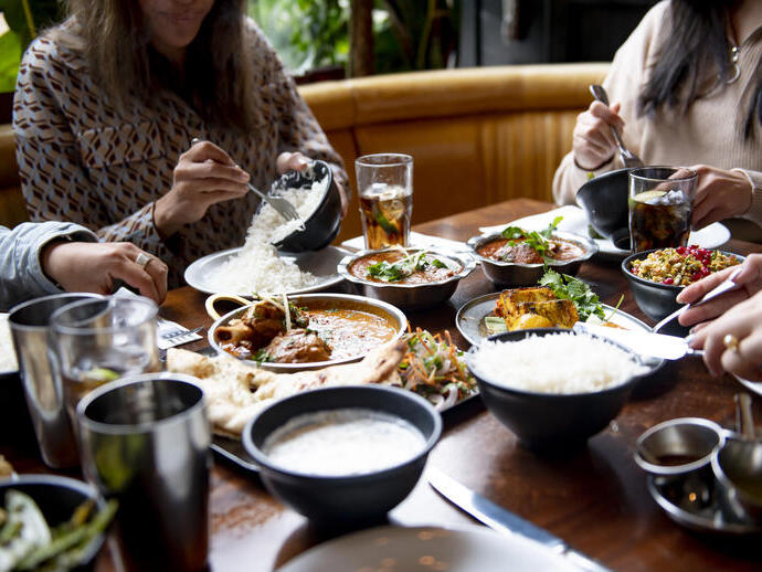 A group of people eating a meal at a table in a restaurant in Birmingham, West Midlands