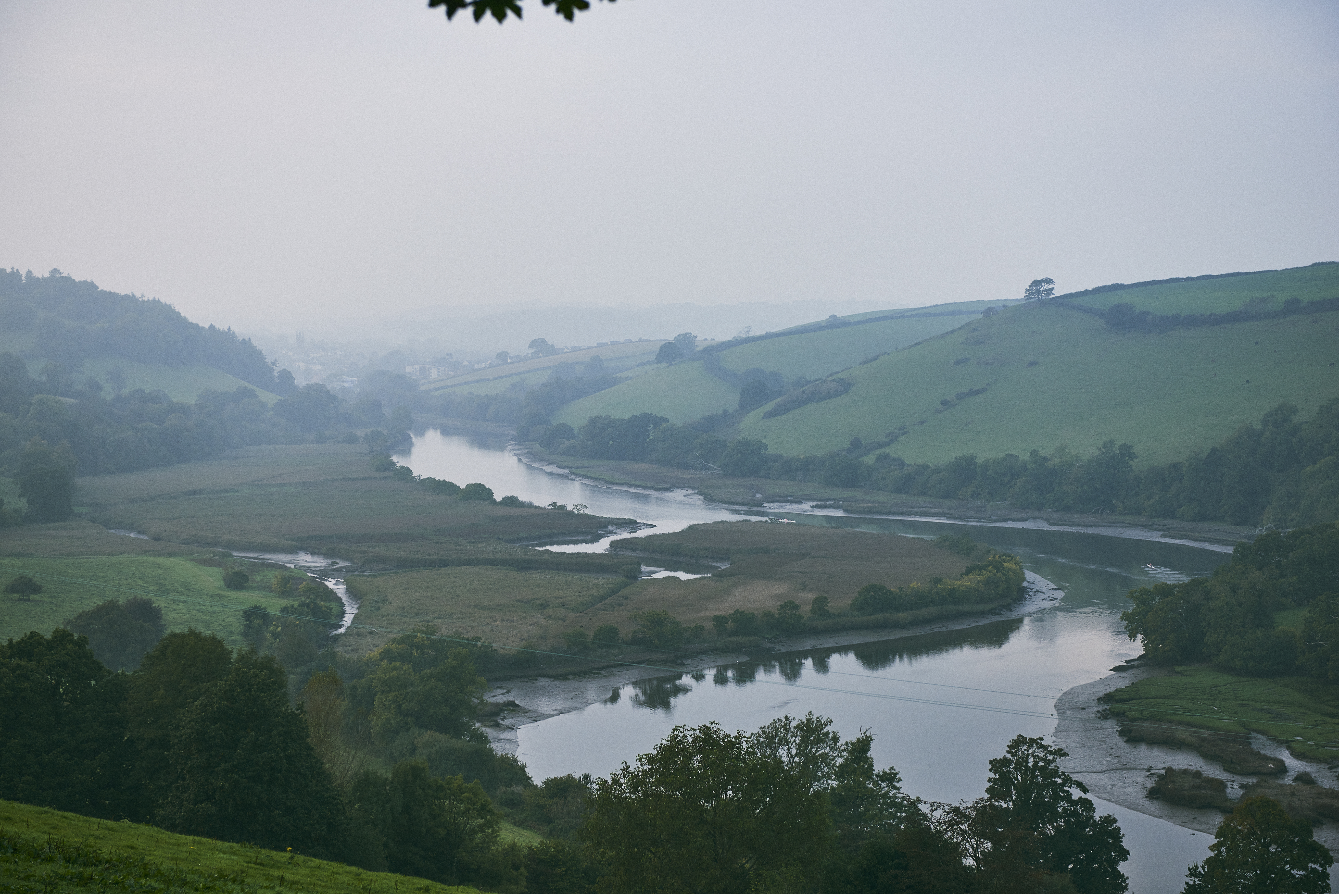 High angle landscape view of a river running through a valley.
