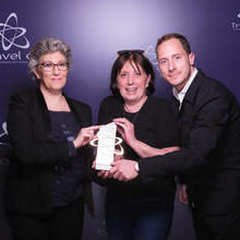 Three people holding an award at Travel dOr 2023