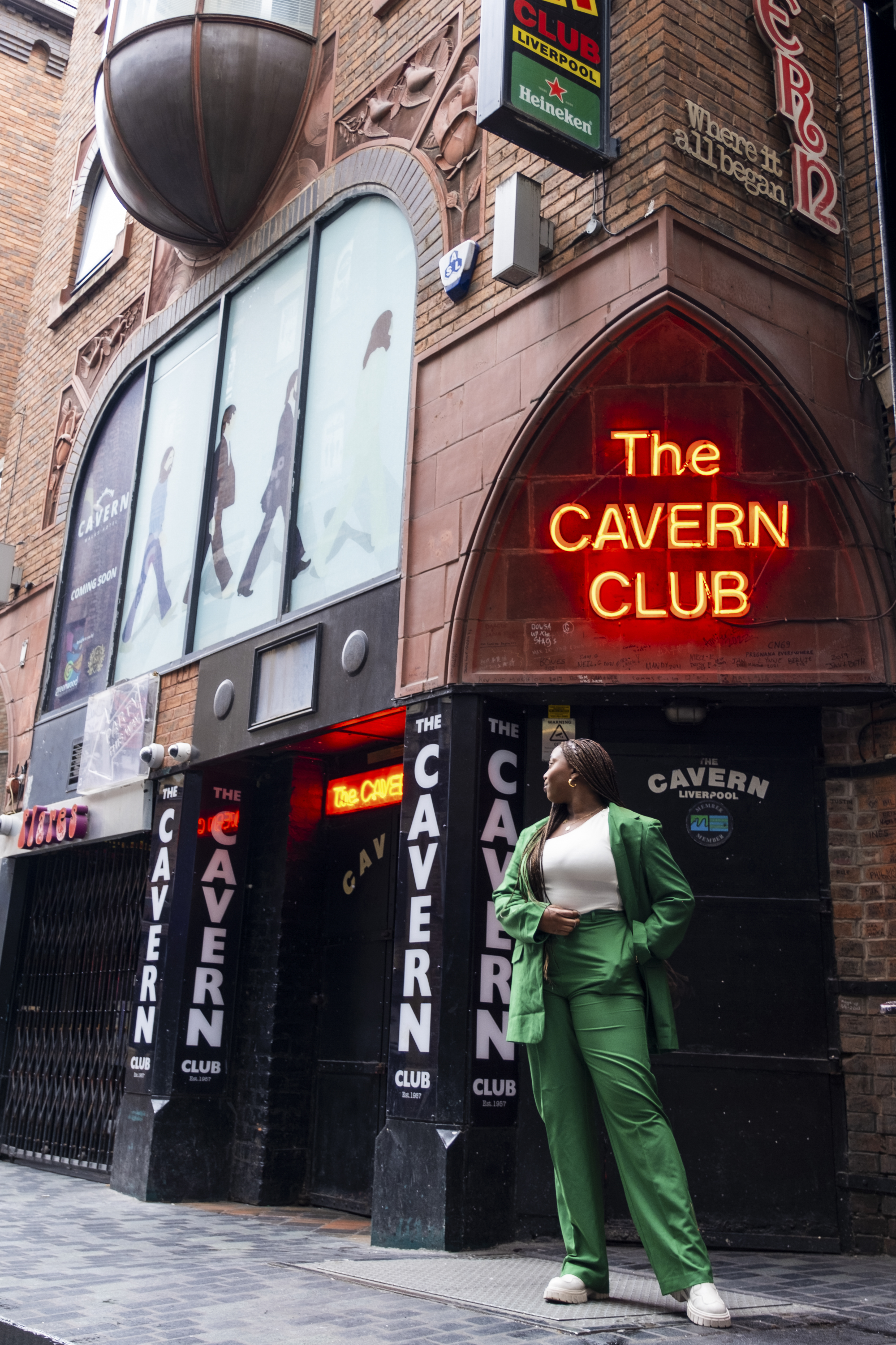 Woman standing on the street outside a club