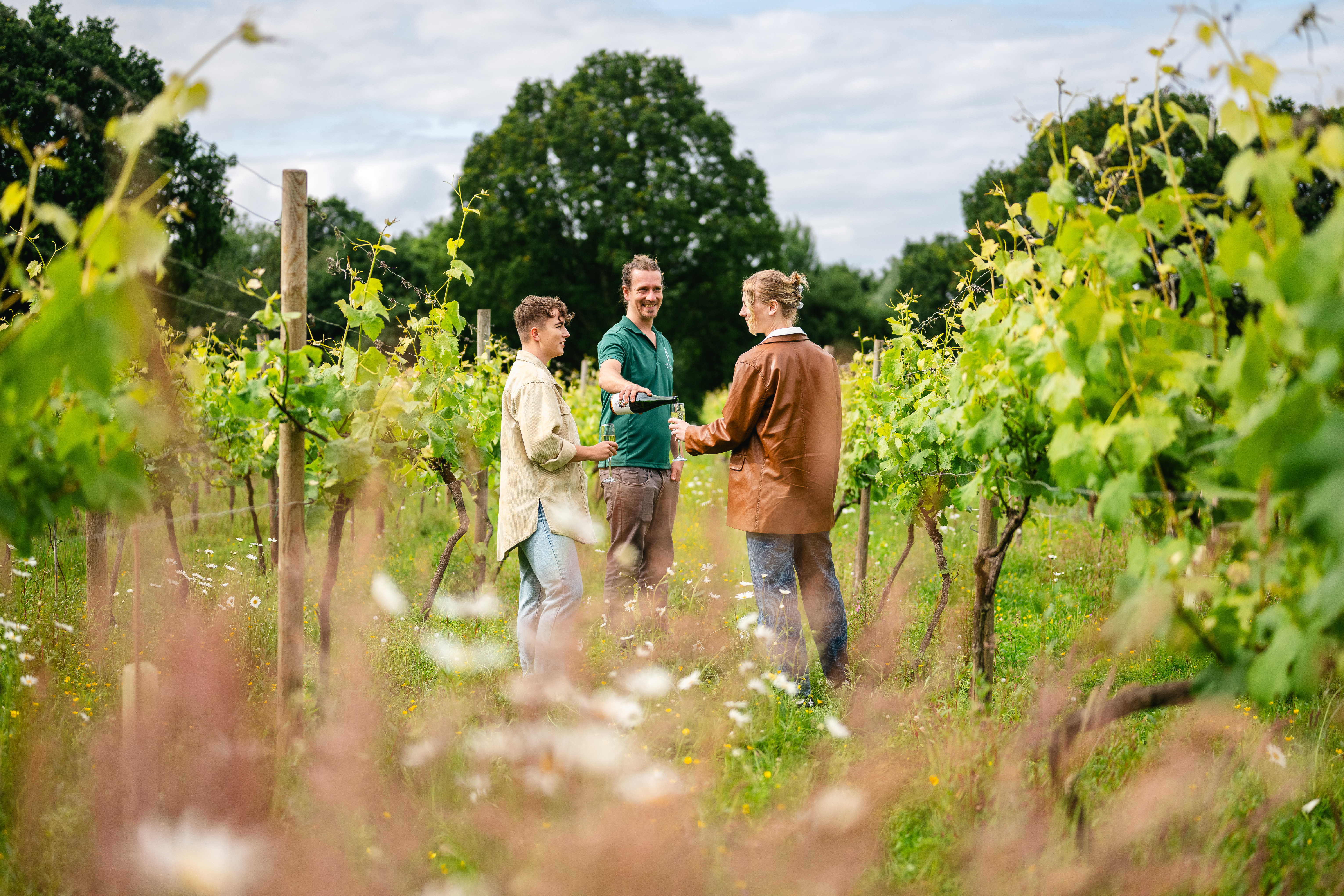 Two women enjoying a guided Vineyard tour and wine tasting experience