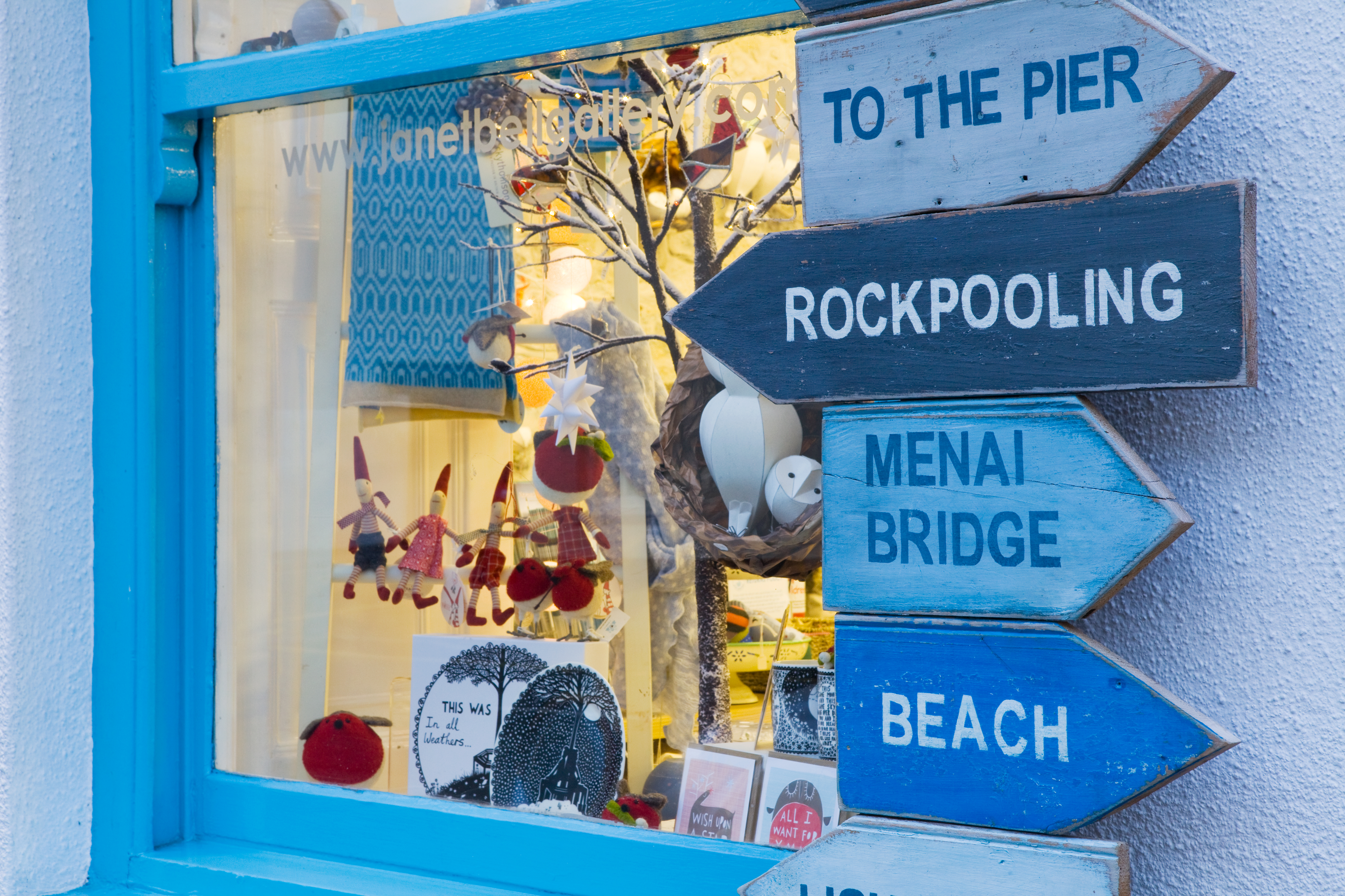 A gallery window filled with cards and decorations