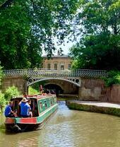 A barge sailing down a canal in Bath