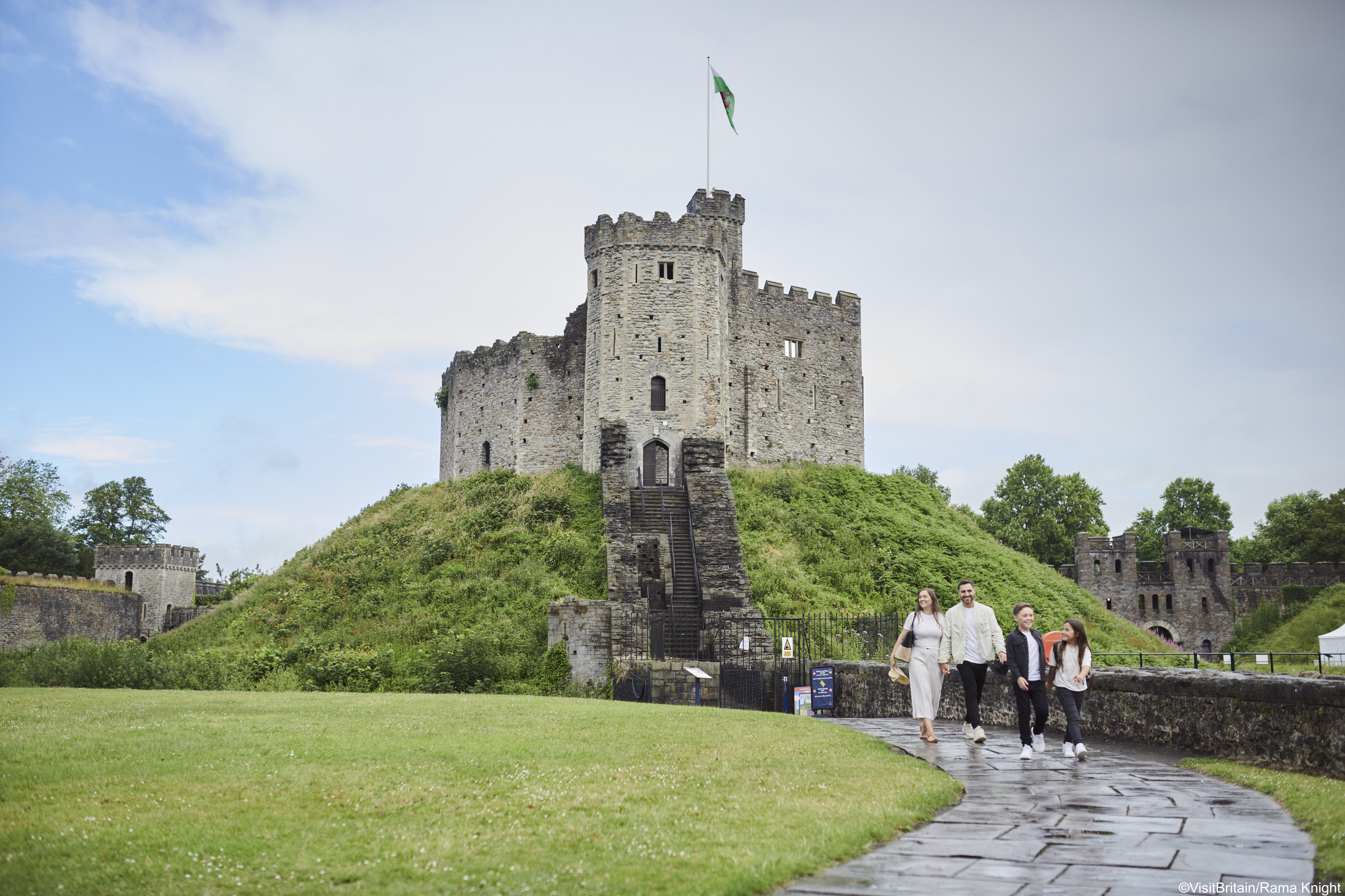 Family walking in front of a castle