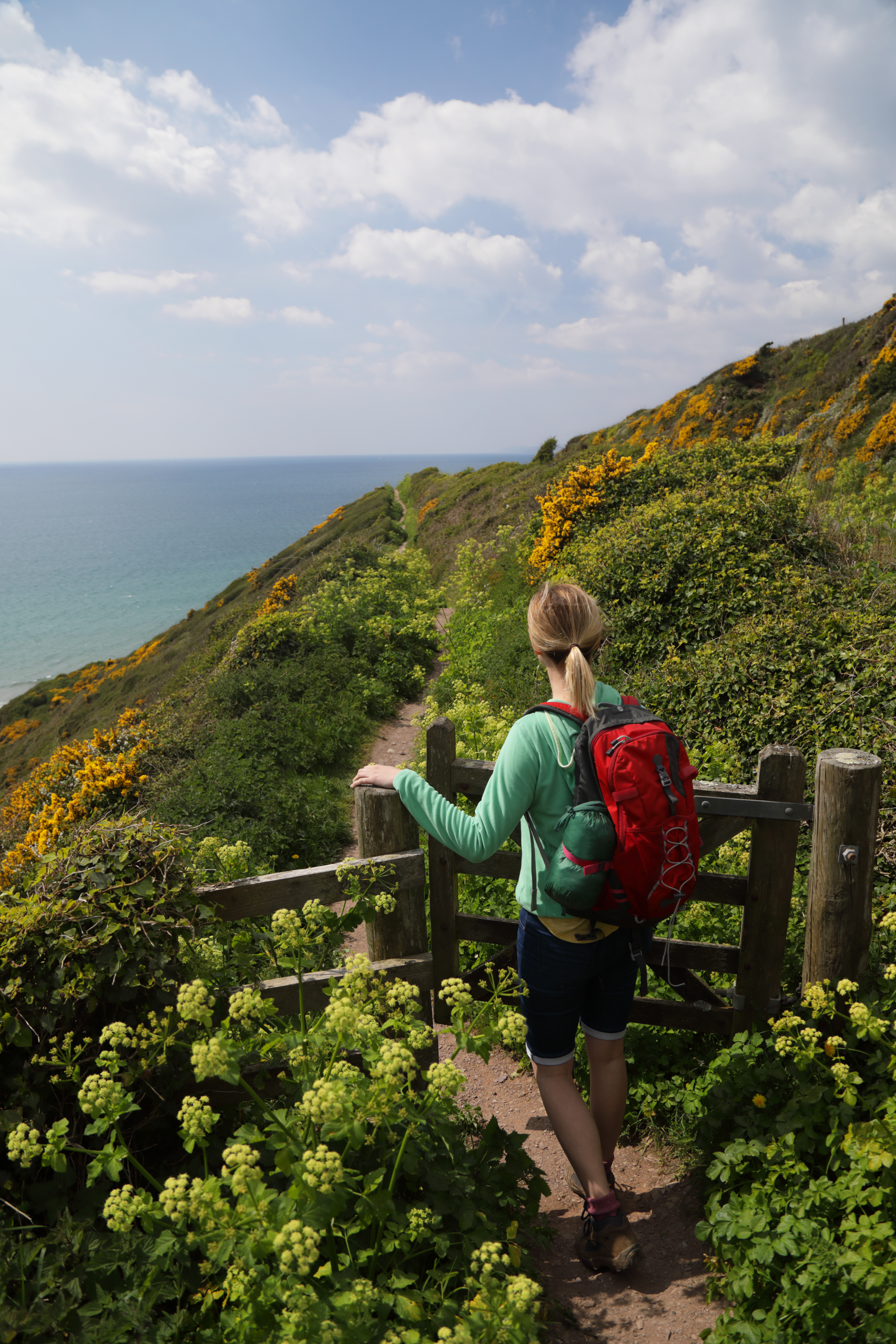 Woman hiking on coastal path