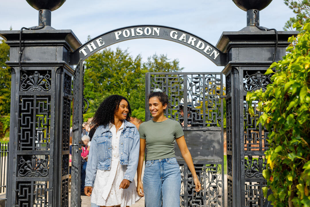 Two women leaving a garden