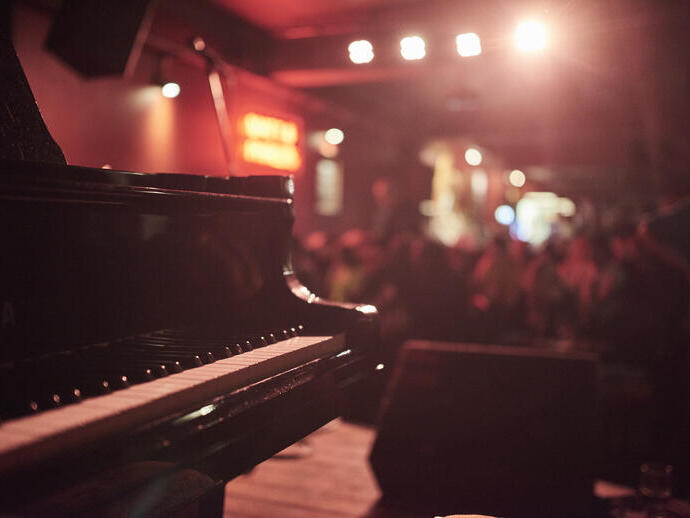Piano on a stage in a bar