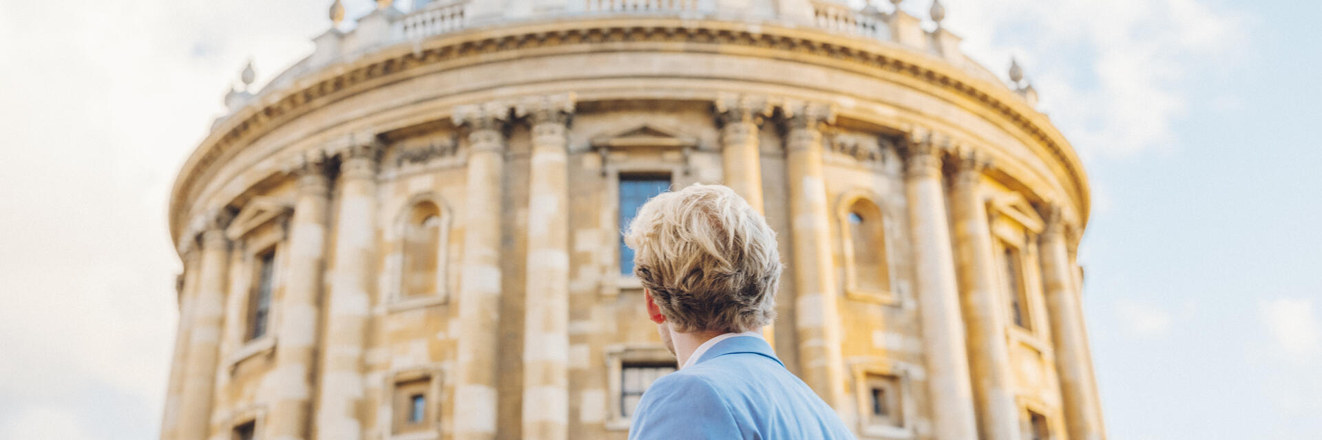 Man looking up at an historical building