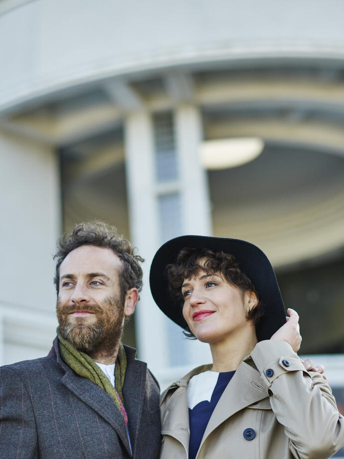 Couple standing outside a building