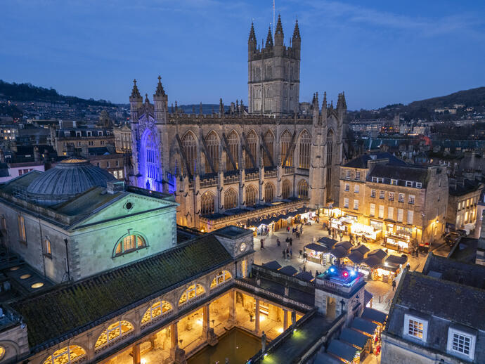 A cathedral, a market and a historic spa lit up at night