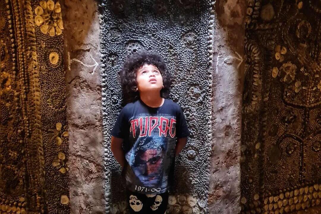 A boy in Shell Grotto