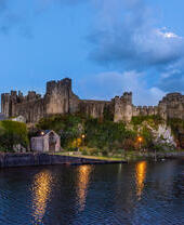 A castle overlooking a river.
